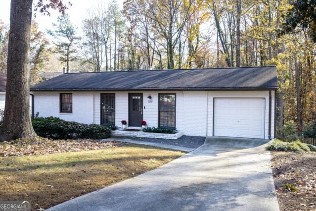 ranch-style house featuring a garage