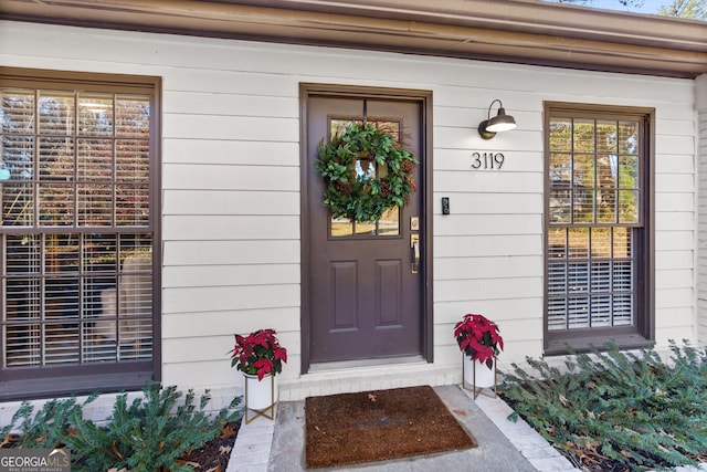 doorway to property featuring covered porch