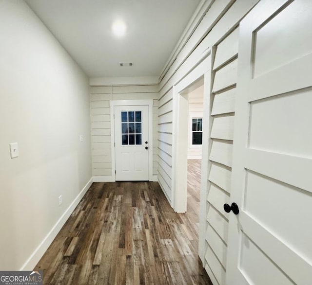 doorway with dark hardwood / wood-style flooring