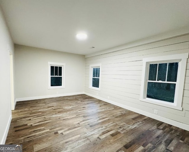 spare room with hardwood / wood-style flooring