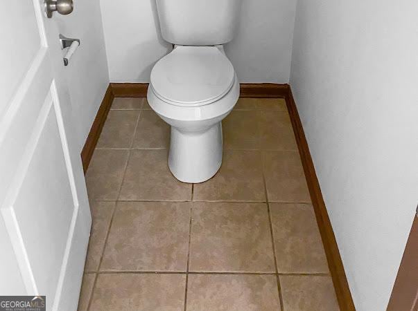 bathroom with tile patterned floors and toilet