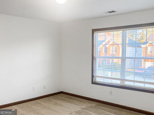 empty room featuring carpet flooring