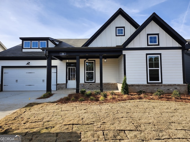 view of front of home with a porch and a garage