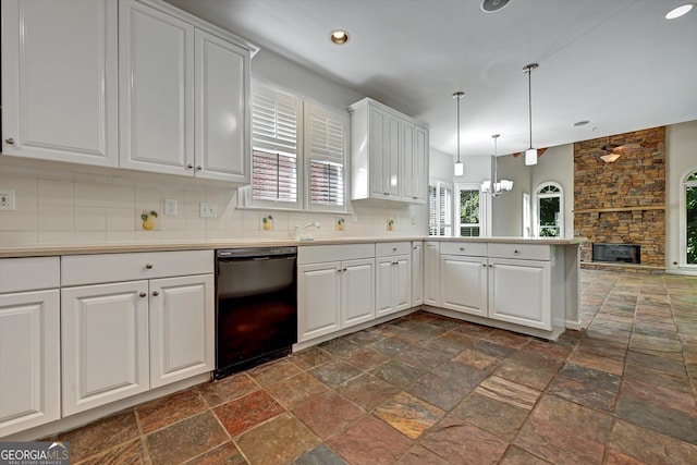 kitchen featuring decorative backsplash, a fireplace, pendant lighting, white cabinets, and black dishwasher