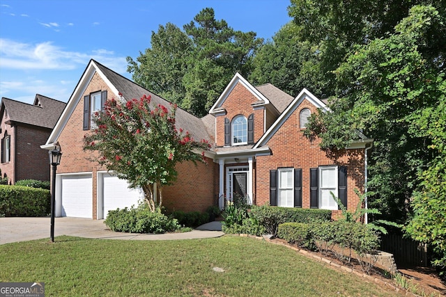 view of front property with a front lawn and a garage