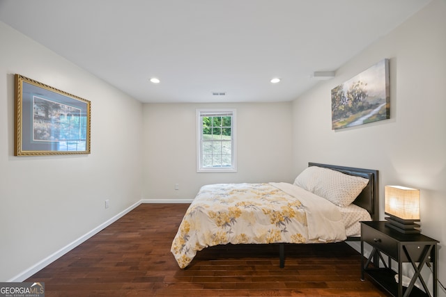 bedroom featuring dark hardwood / wood-style floors