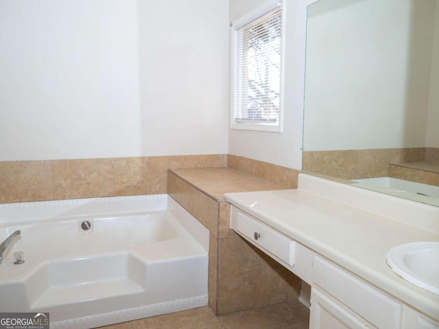 bathroom with tile patterned flooring, vanity, and a bathing tub