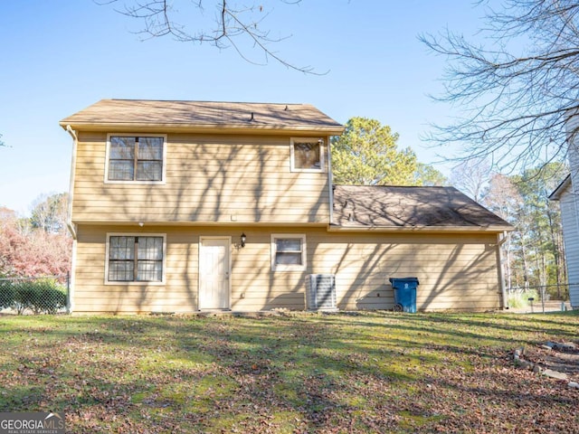 rear view of property with a yard