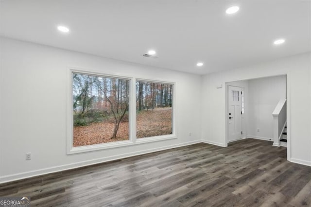 interior space with dark hardwood / wood-style floors