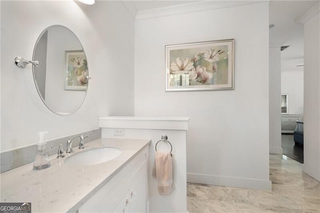 bathroom with vanity and ornamental molding