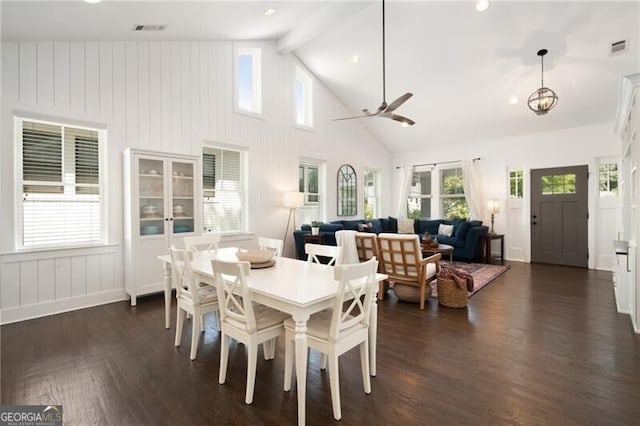 dining area featuring beam ceiling, dark hardwood / wood-style floors, high vaulted ceiling, and ceiling fan