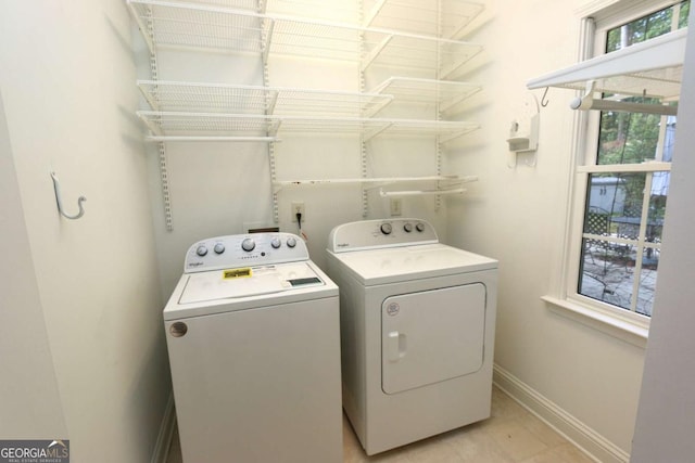 laundry room with washing machine and clothes dryer