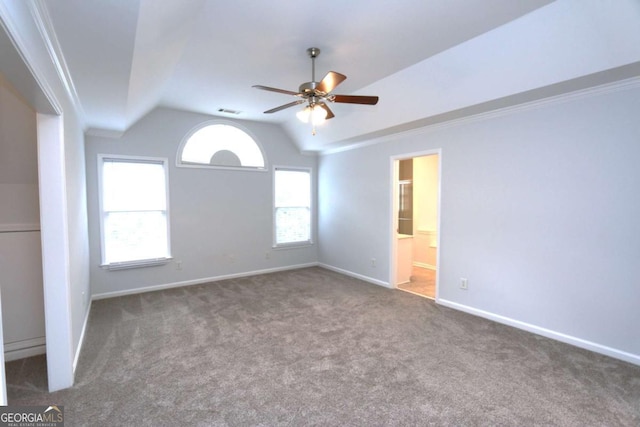 unfurnished room with lofted ceiling, ceiling fan, carpet floors, and crown molding