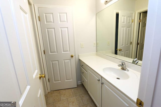 bathroom with vanity and tile patterned flooring