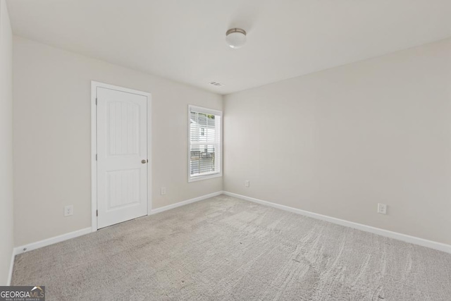 view of carpeted spare room