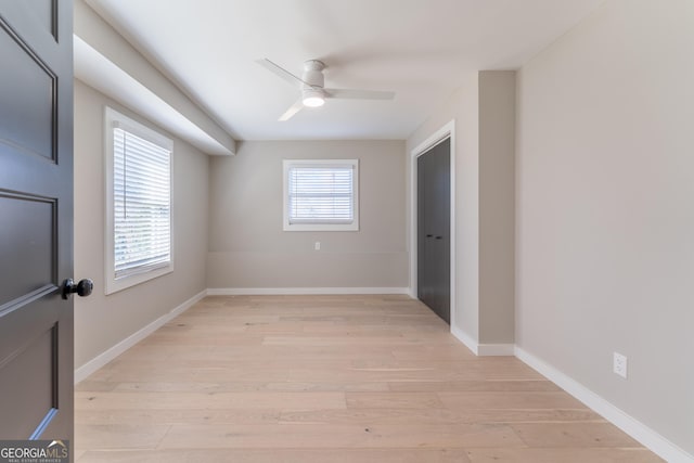 spare room featuring ceiling fan and light hardwood / wood-style flooring