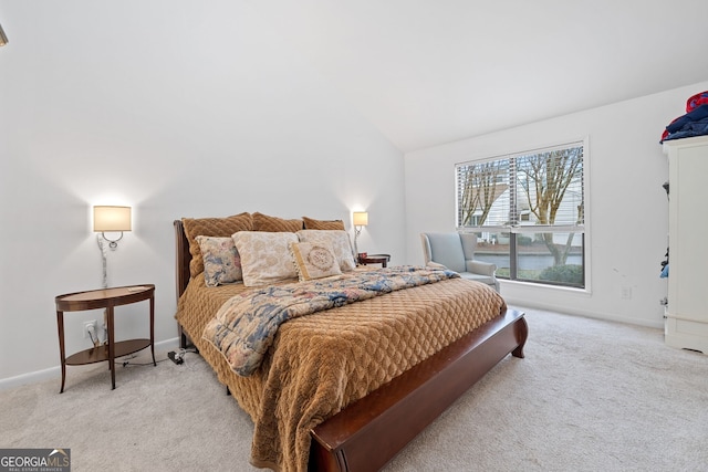 carpeted bedroom featuring vaulted ceiling