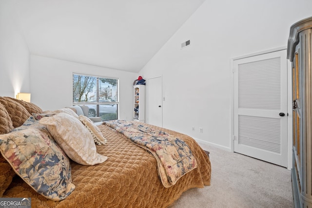 bedroom featuring carpet flooring and high vaulted ceiling