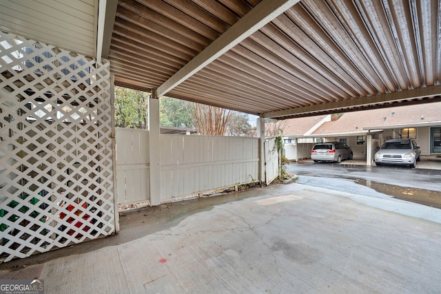 view of parking / parking lot with a carport