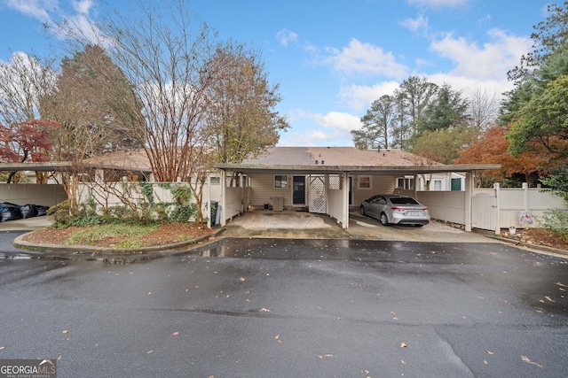 view of front of property featuring a carport