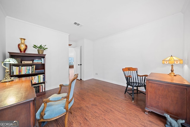 home office featuring dark hardwood / wood-style flooring and crown molding