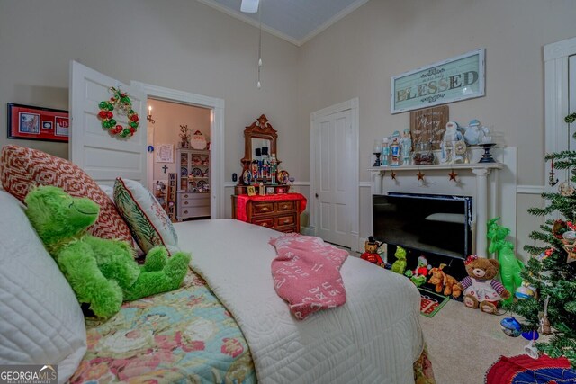 bedroom with a fireplace, high vaulted ceiling, and ornamental molding