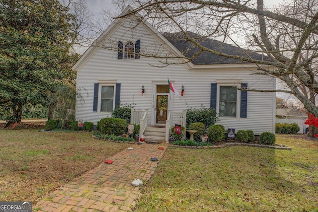 traditional-style house with a front lawn