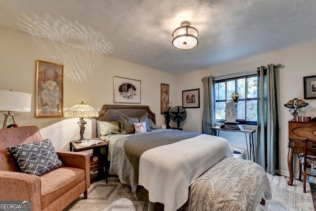 bedroom featuring a textured ceiling