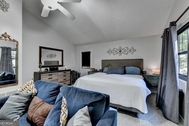 carpeted bedroom featuring high vaulted ceiling and ceiling fan