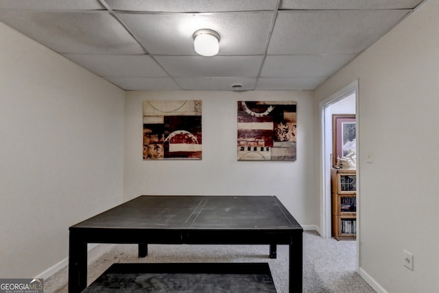 playroom with carpet and a paneled ceiling