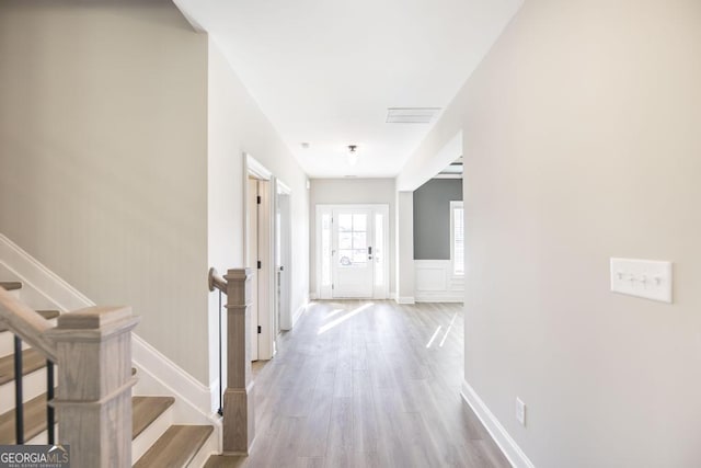 408 Bella Notte Cir Unit 26A, Warner Robins, GA 31088 - corridor with light wood-type flooring and stairway