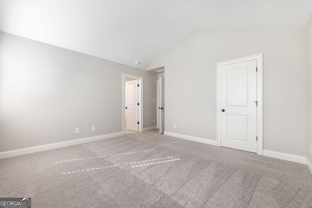 408 Bella Notte Cir Unit 26A, Warner Robins, GA 31088 - unfurnished bedroom with vaulted ceiling and carpet floors