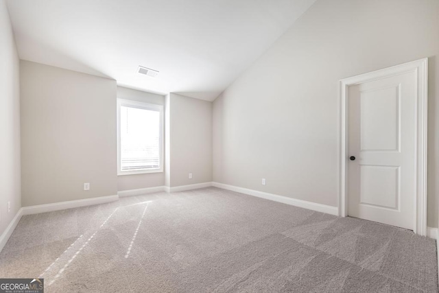 408 Bella Notte Cir Unit 26A, Warner Robins, GA 31088 - carpeted spare room featuring lofted ceiling and baseboards