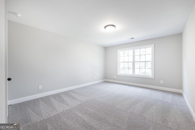 408 Bella Notte Cir Unit 26A, Warner Robins, GA 31088 - empty room with carpet and a smoke detector