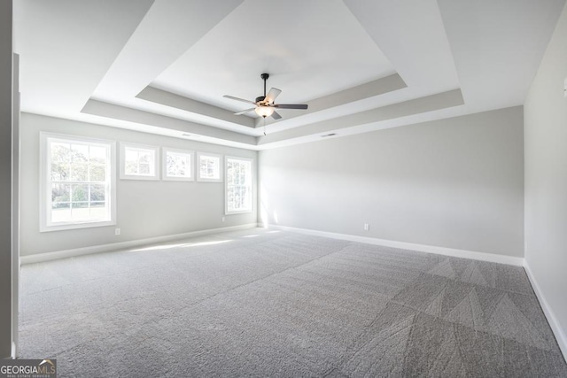408 Bella Notte Cir Unit 26A, Warner Robins, GA 31088 - spare room with a raised ceiling, carpet flooring, and a ceiling fan