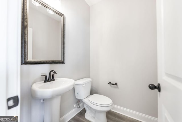 408 Bella Notte Cir Unit 26A, Warner Robins, GA 31088 - bathroom featuring baseboards and wood finished floors
