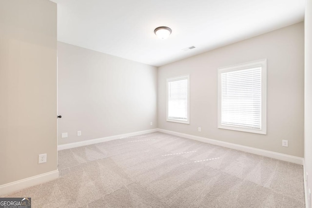408 Bella Notte Cir Unit 26A, Warner Robins, GA 31088 - spare room featuring carpet and baseboards