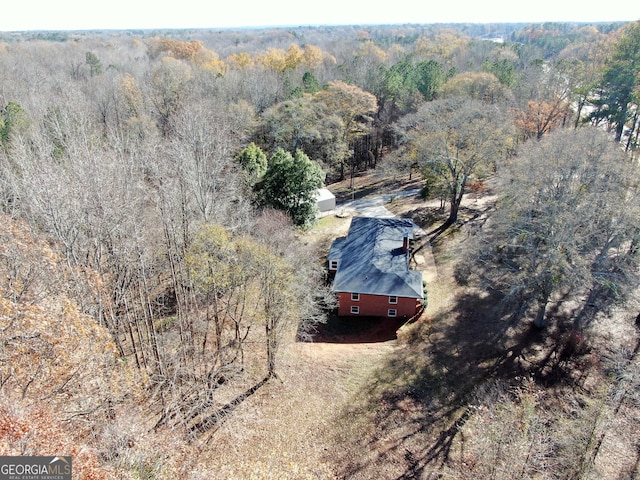 drone / aerial view featuring a view of trees