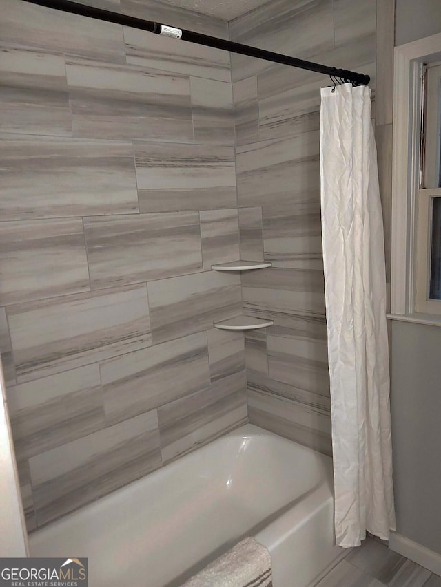 bathroom with shower / tub combo