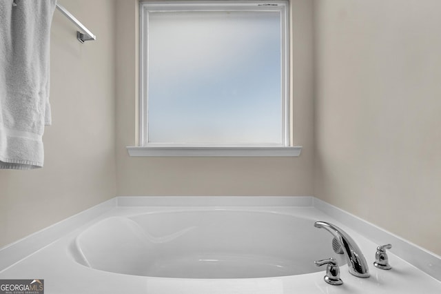 299 Archibald Ave SE, Ludowici, GA 31316 - full bathroom with a wealth of natural light and a bath