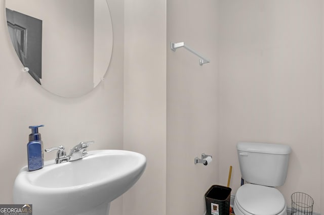 299 Archibald Ave SE, Ludowici, GA 31316 - half bath featuring a sink and toilet