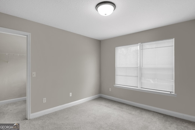 299 Archibald Ave SE, Ludowici, GA 31316 - interior space with light carpet and baseboards