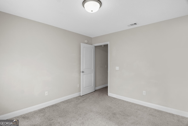 299 Archibald Ave SE, Ludowici, GA 31316 - carpeted empty room featuring baseboards and visible vents