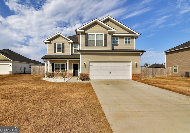 299 Archibald Ave SE, Ludowici, GA 31316 - craftsman inspired home with covered porch, driveway, an attached garage, and fence