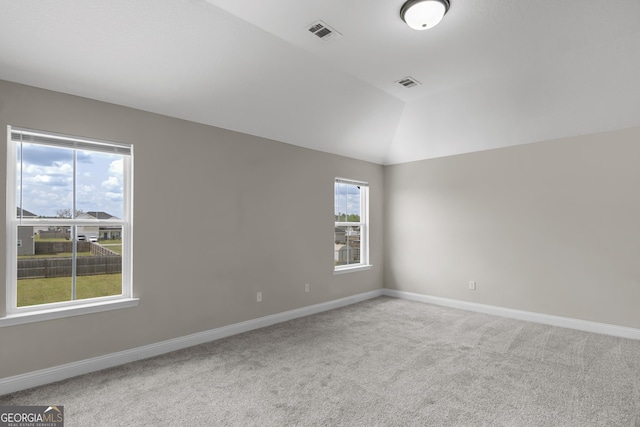 299 Archibald Ave SE, Ludowici, GA 31316 - spare room featuring a wealth of natural light, visible vents, and light colored carpet