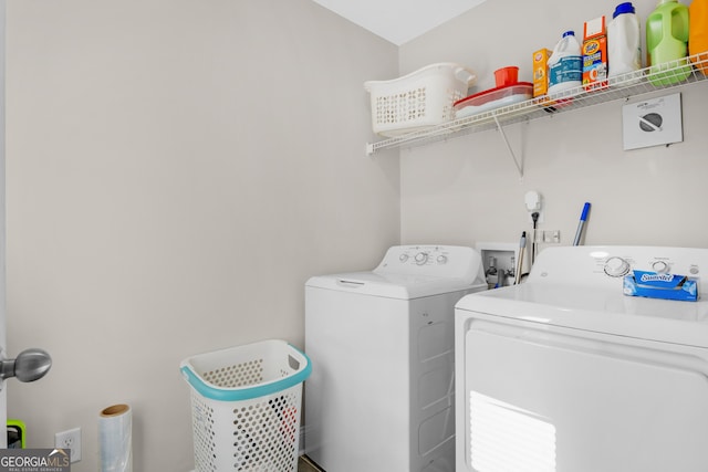 299 Archibald Ave SE, Ludowici, GA 31316 - clothes washing area with washing machine and clothes dryer and laundry area