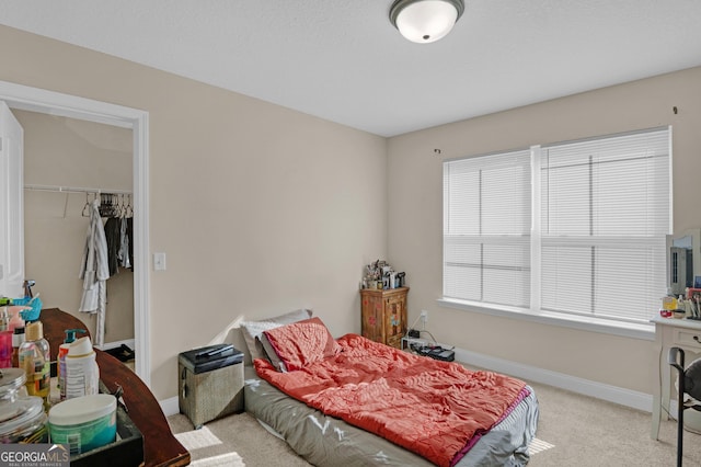 carpeted bedroom with a closet