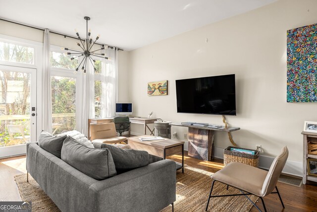 living room featuring hardwood / wood-style floors and a chandelier