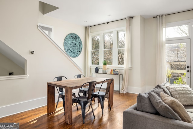 dining area with dark hardwood / wood-style floors