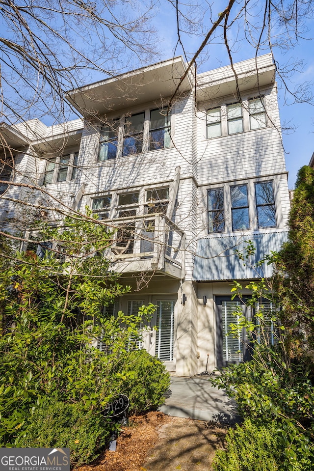 view of front of home with a balcony